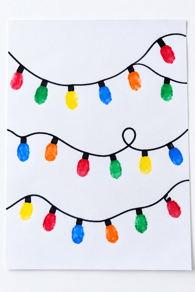 a fingerprint Christmas lights craft with colorful fingerprint bulbs stamped along a drawn black cord on white paper