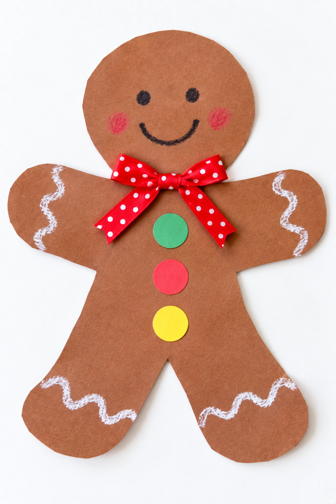 a brown paper gingerbread man craft with wavy white icing lines, button dots, and a ribbon bow at the neck