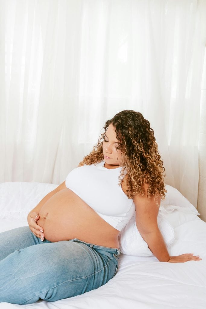 pregnant woman in a white background