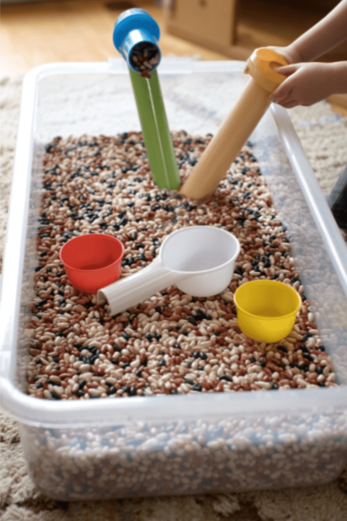 a Bean and Funnel Sensory Play Table designed for toddlers and young children