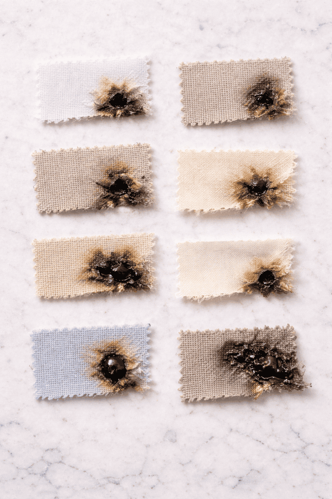 a variety of fabric samples after undergoing a burn test