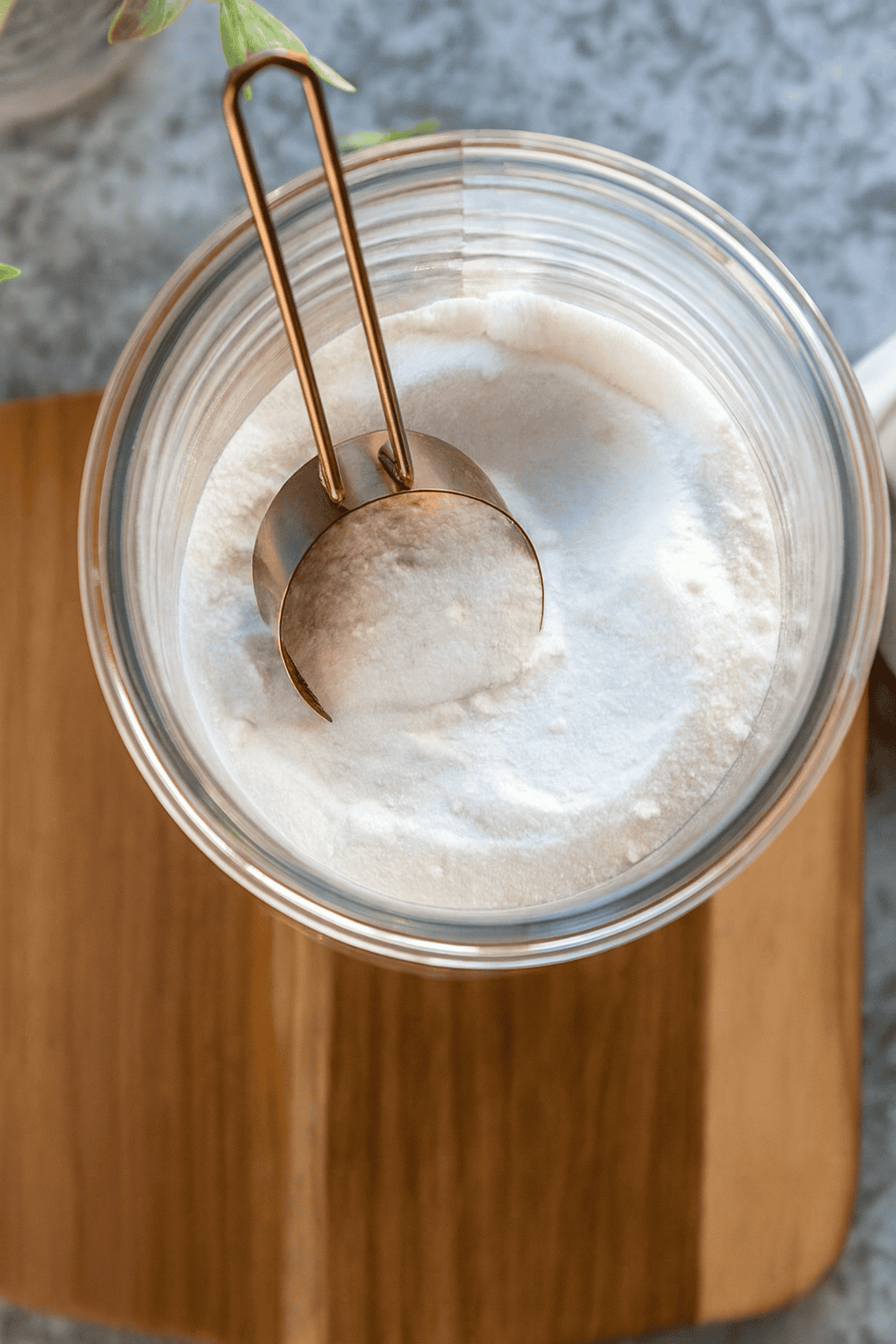 a glass jar filled with homemade non-toxic powdered laundry detergent