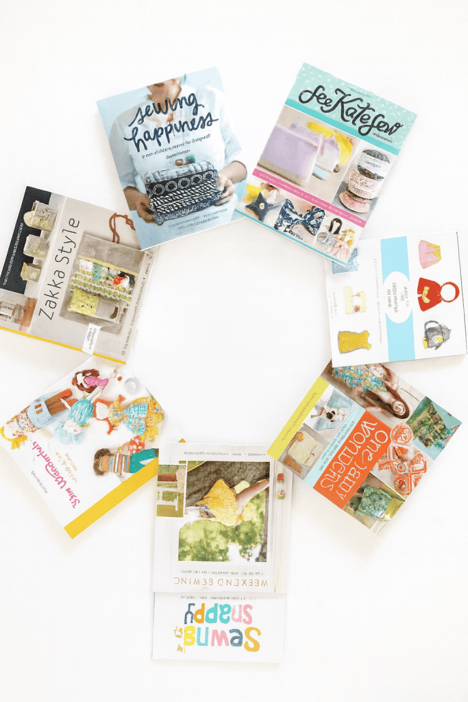 a curated circle arrangement of modern sewing and crafting books on a bright white surface