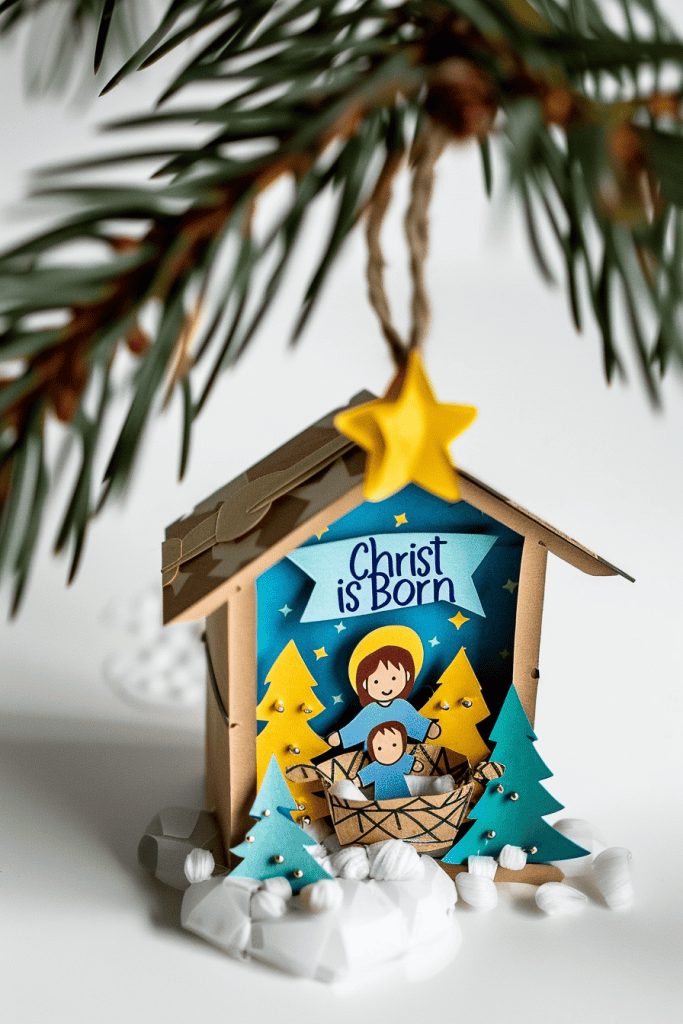 a children’s Christmas ornament craft representing nativity scene, paper ornament with cutout manger and baby Jesus, Christ is Born written in marker