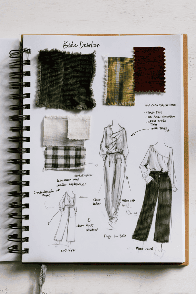 abric swatches carefully pinned or glued onto the paper including deep forest green corduroy, beige linen, rich burgundy cotton, and a plaid green-and-white fabric