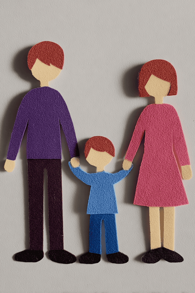 a handcrafted paper cutout representing a family.