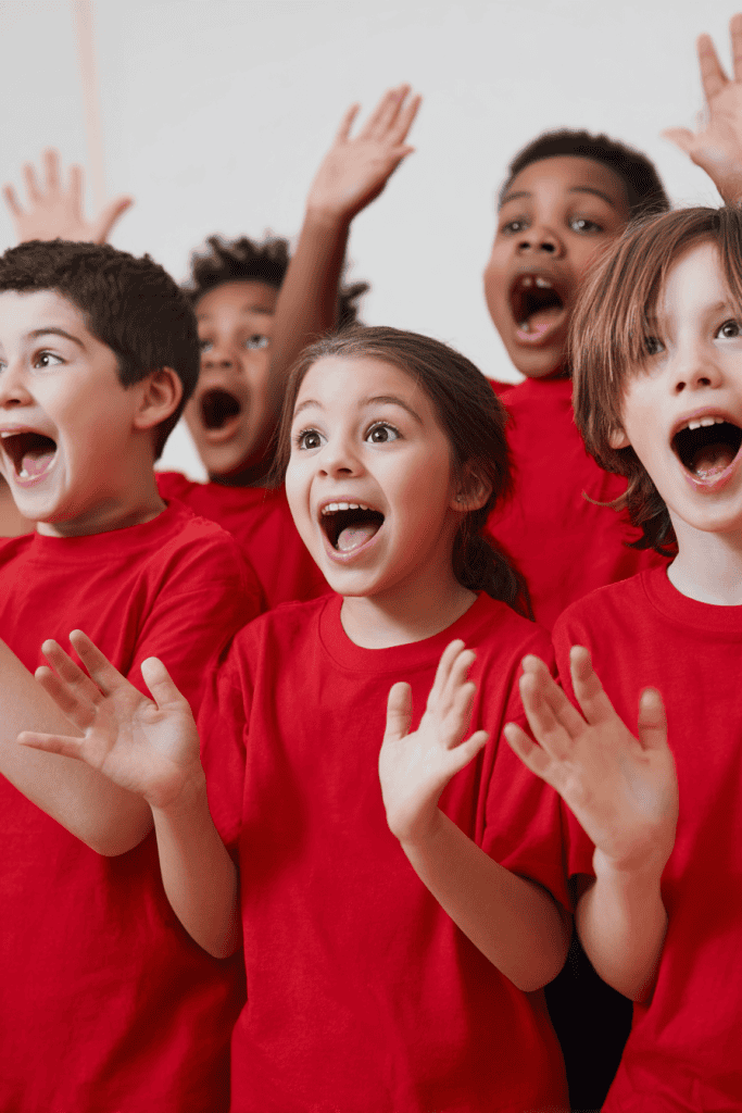 a dynamic and expressive group of school-aged children participating in a high-energy performance, classroom skit, or drama activity.