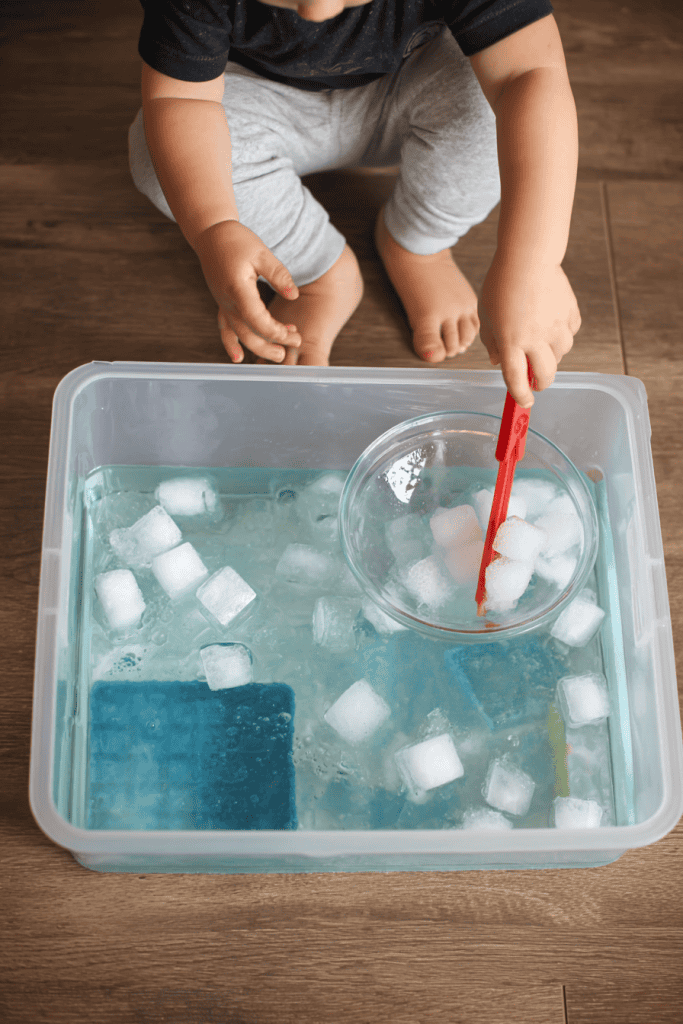 a fine motor sensory play activity using ice cubes and water