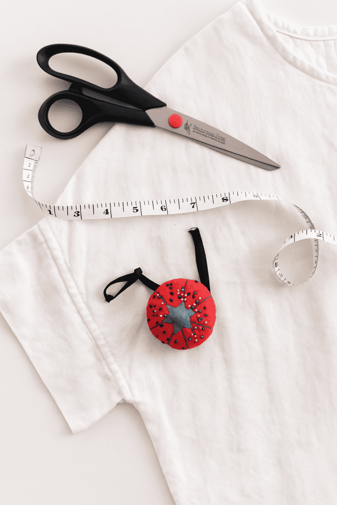 a neatly pressed, natural white cotton or linen t-shirt laid flat on a white surface