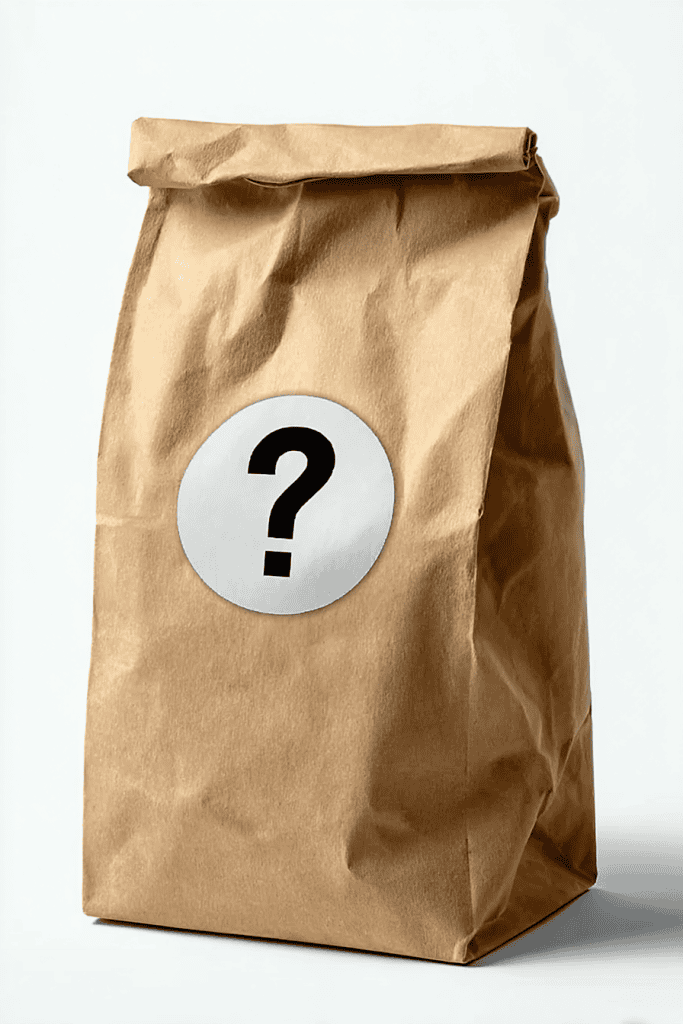 a plain brown paper lunch bag standing upright on a clean, white background