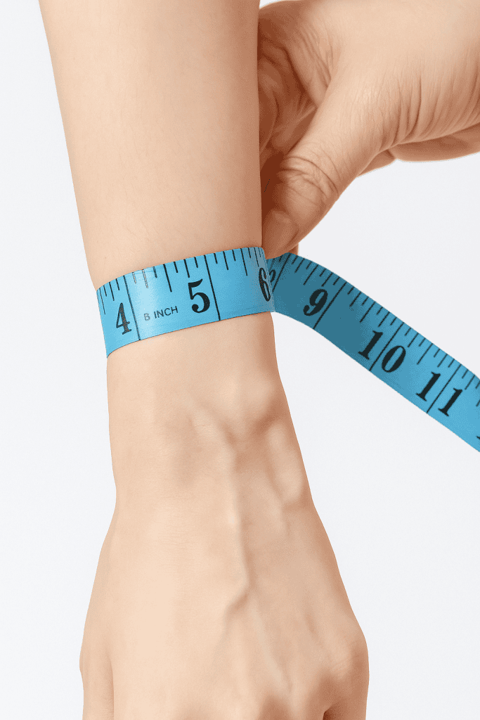 a woman measuring a wrist