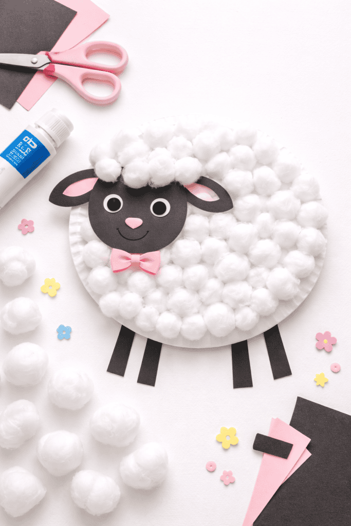 a completed Cotton Ball Lamb craft displayed on a clean white or light pastel background
