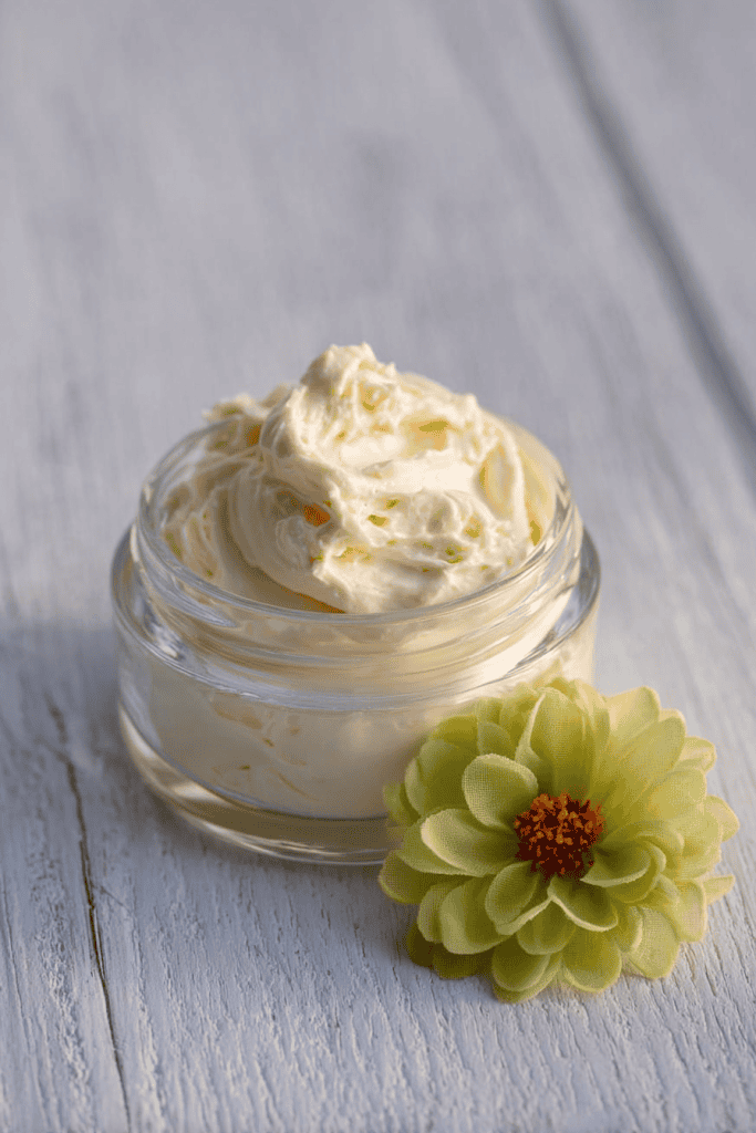 a small glass jar filled with creamy, whipped beef tallow face cream.