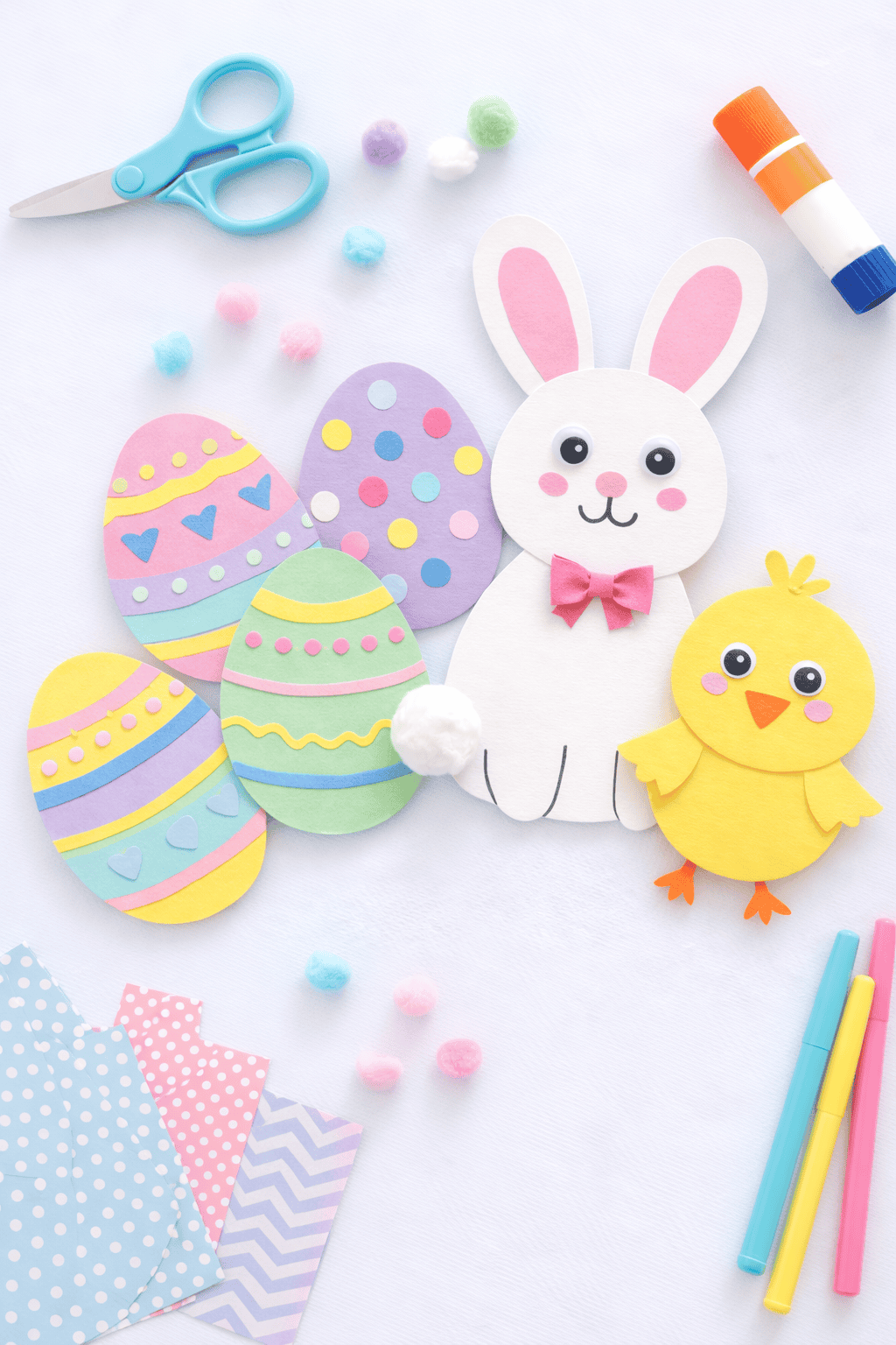 a cheerful handmade Easter project such as decorated paper eggs, a bunny craft made from construction paper, and a small chick craft.