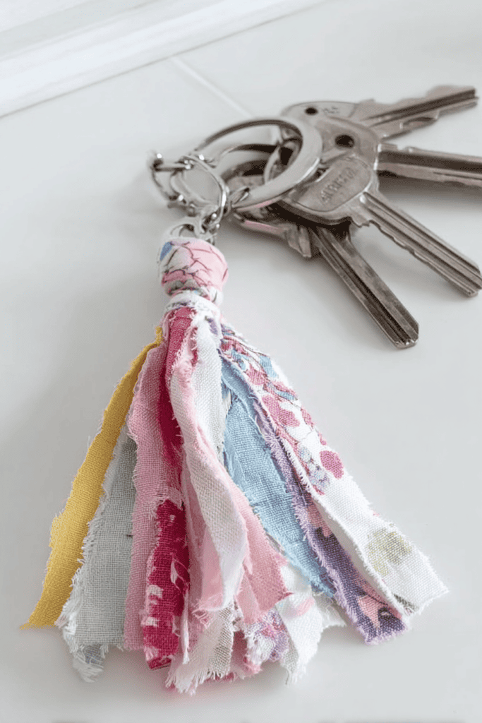 handmade fabric tassel keychain made from colorful scrap fabric strips.