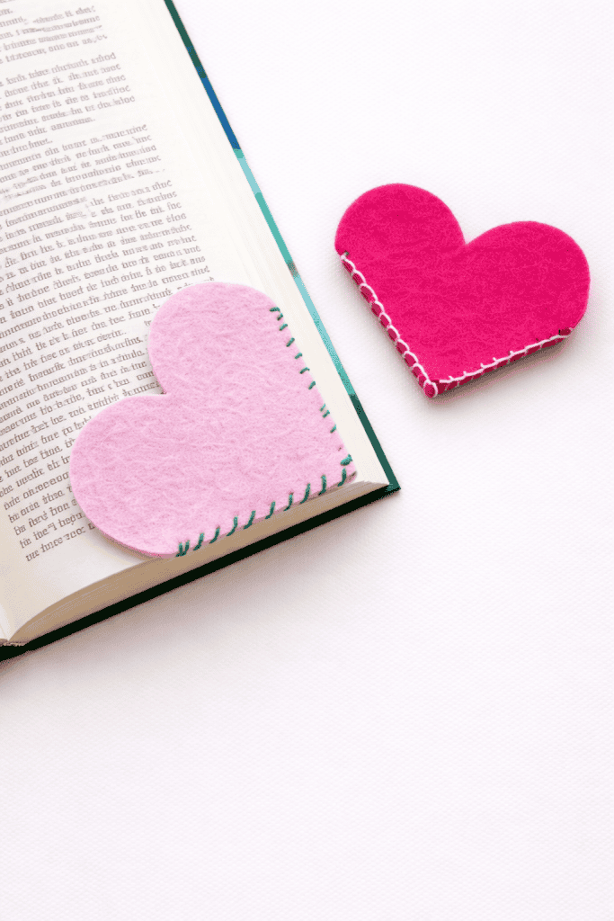 Handmade felt heart bookmarks on book