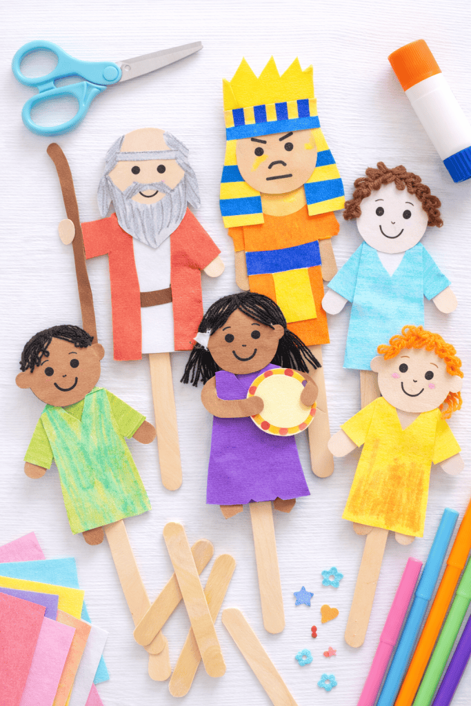 child-created puppets using simple craft materials like popsicle sticks, paper bags, or cardstock cutouts glued onto craft sticks.