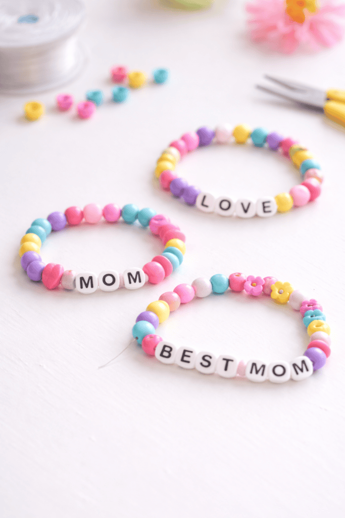 handmade DIY beaded bracelets created by elementary-aged children as a Mother’s Day gift.