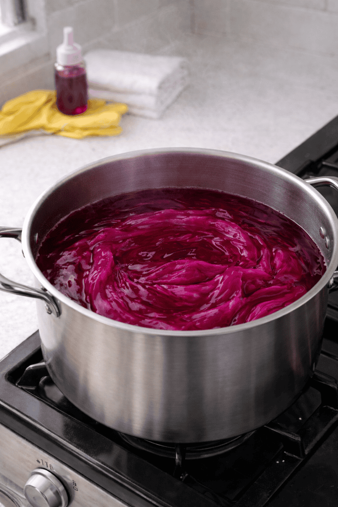 fabric soaking in a hot dye bath during the fabric dyeing process