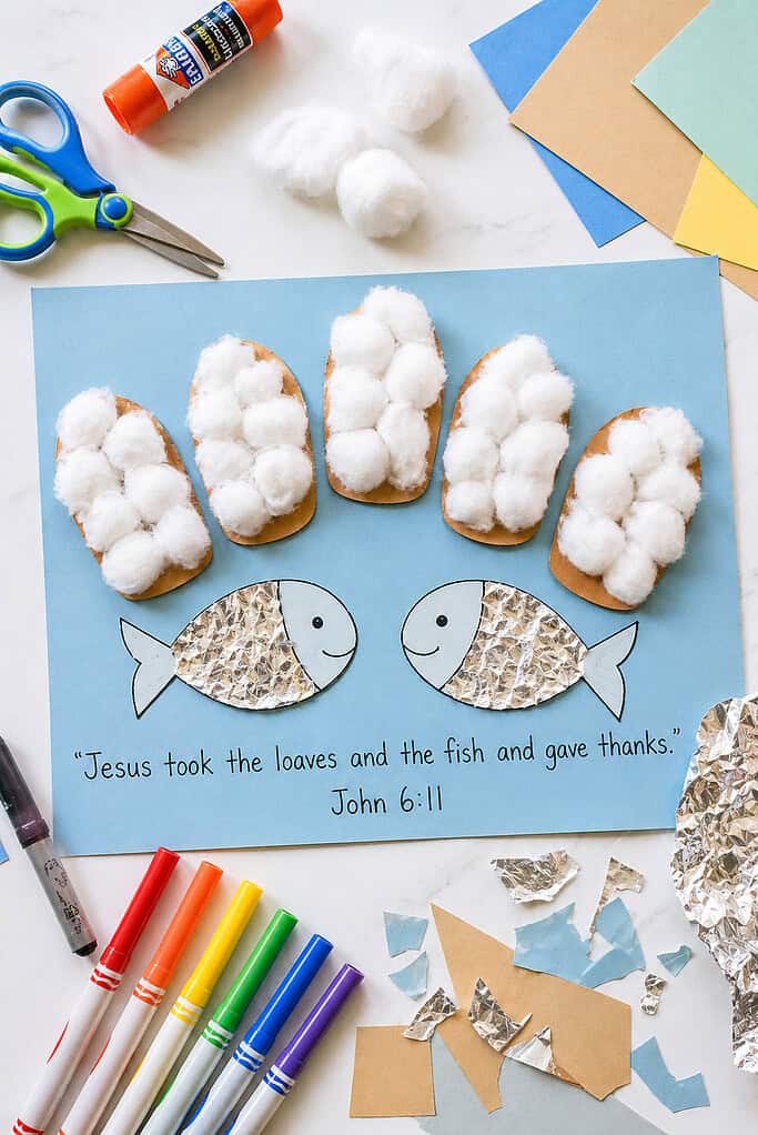 a simple cardstock craft layout: a rectangular sheet of colored cardstock (light blue, soft beige, or pastel tone) as the base