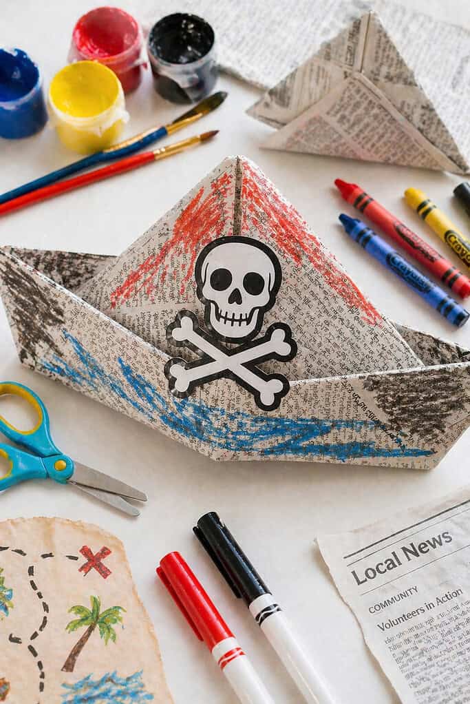 a classic folded pirate hat made from a double sheet of newspaper