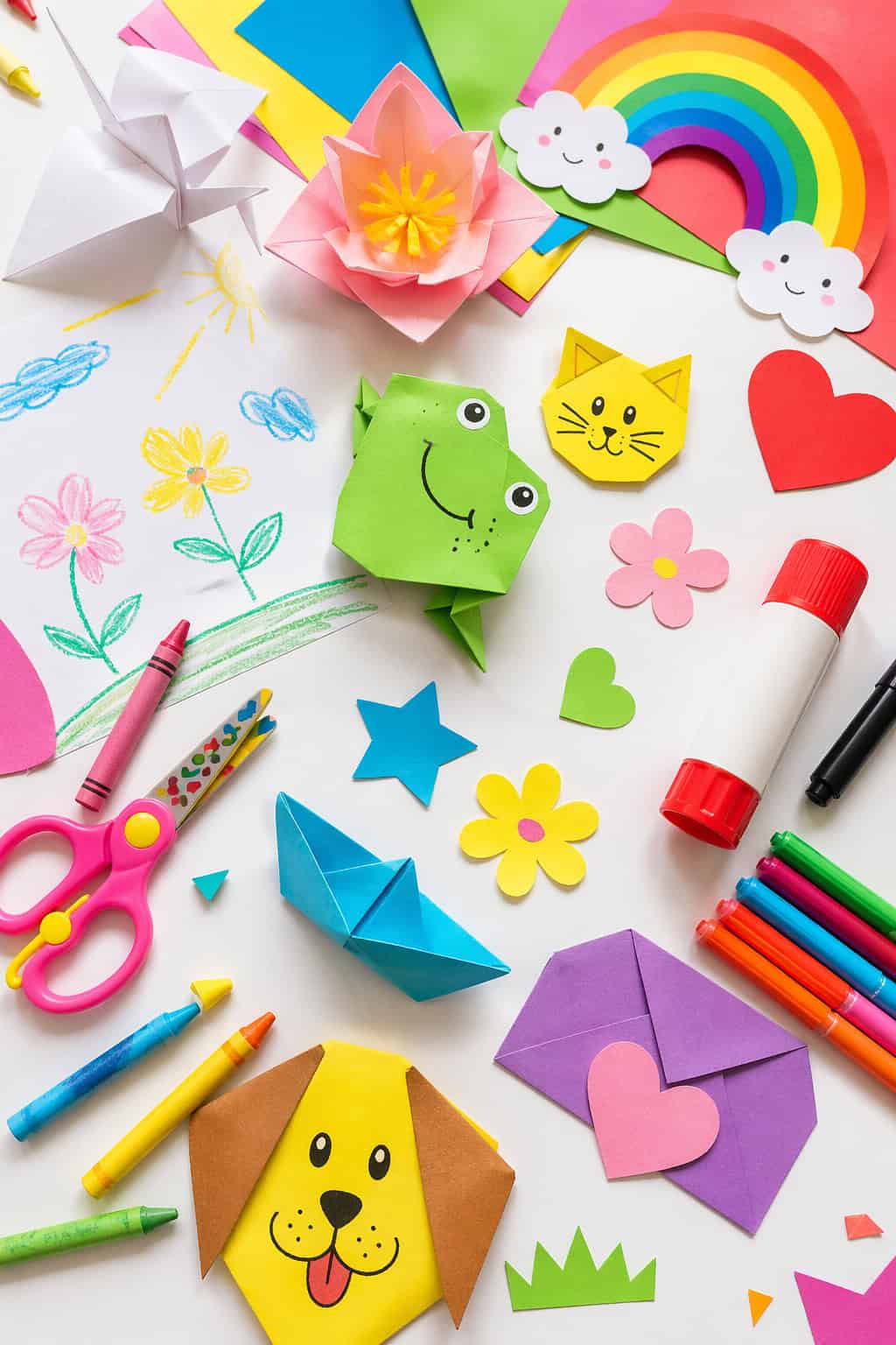 a visually pleasing flat lay of assorted paper craft supplies spread organically across the surface