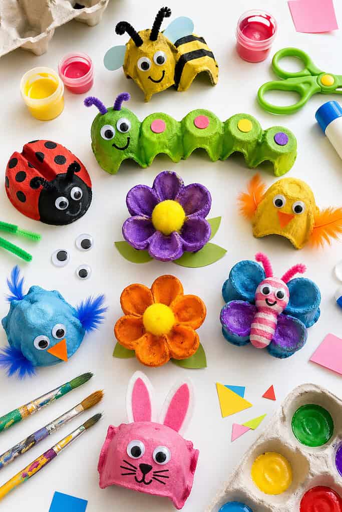 a variety of adorable egg carton crafts such as painted animals (e.g., ladybugs, caterpillars, bees, chicks), small flowers, and mini characters.