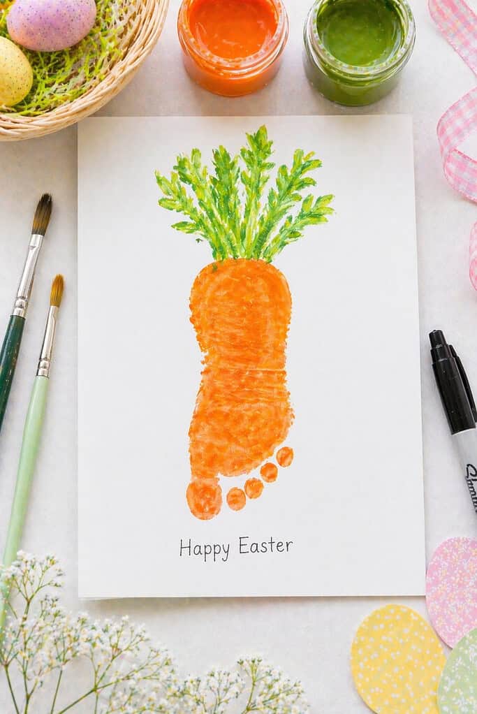 a single child’s footprint stamped in vibrant orange paint onto clean white or pastel cardstock.