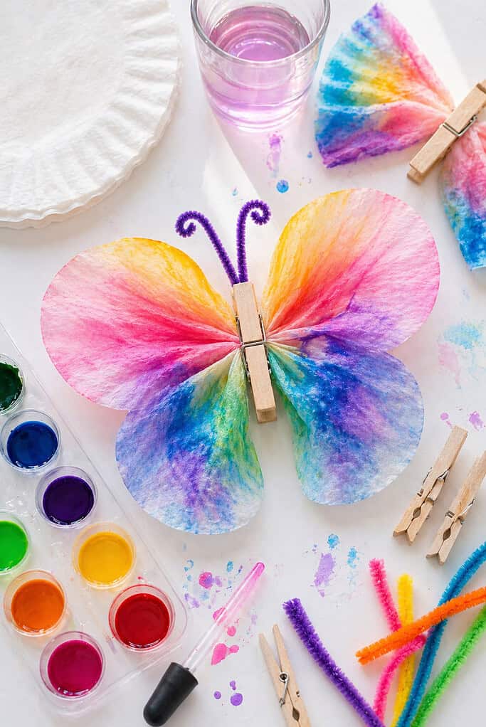 A dried coffee filter transformed into butterfly wings, displaying beautiful, organic watercolor blending