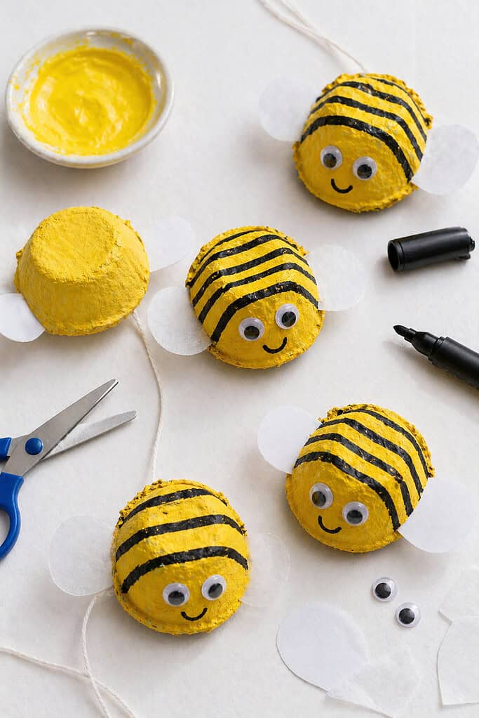 several small bees made from single egg carton cups