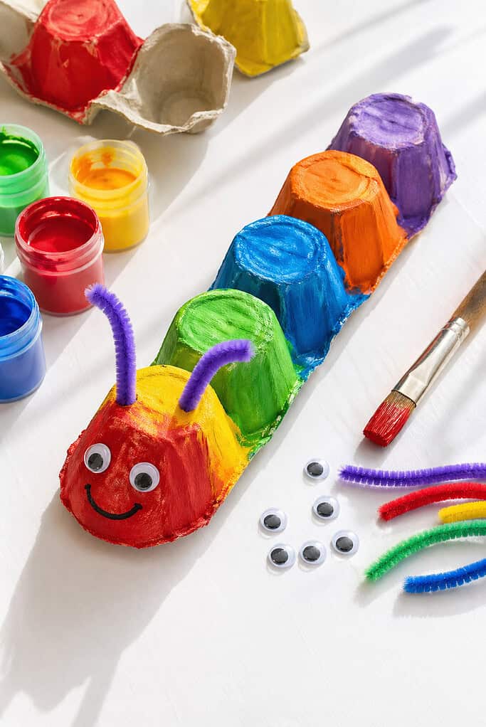 a handmade caterpillar created from a strip of egg carton cups (about 5 segments)