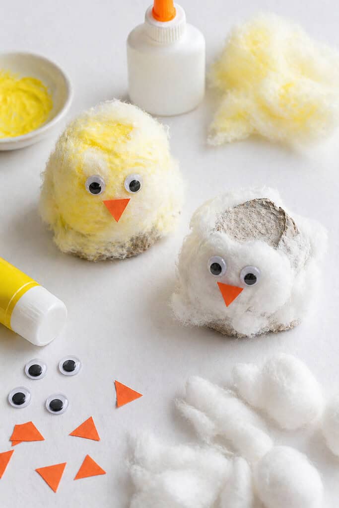 several small chicks made from single egg carton cups turned upside down to form the base.