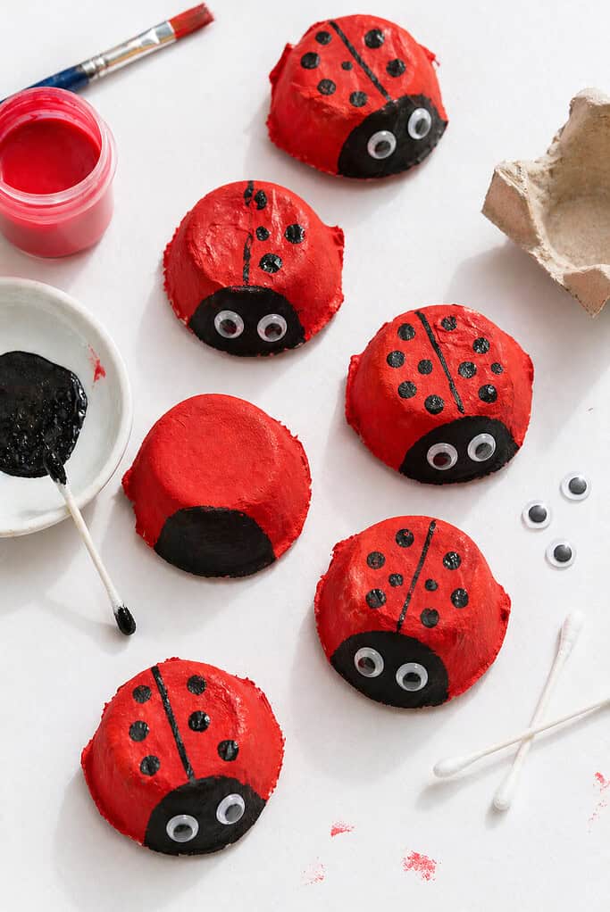 several small ladybugs made from single egg carton cups.