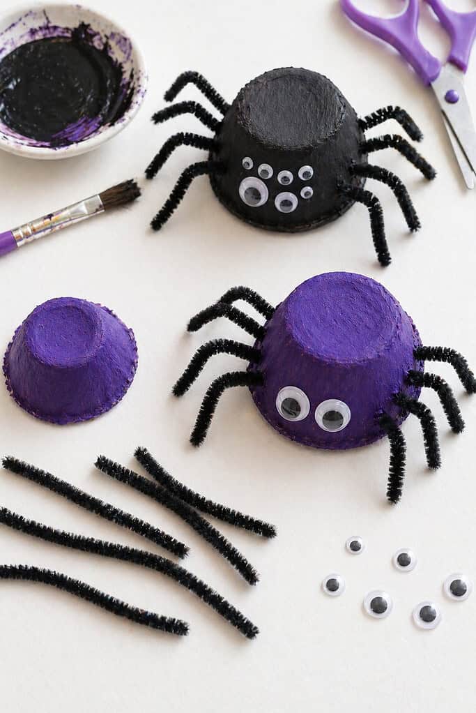 several spiders made from single egg carton cups
