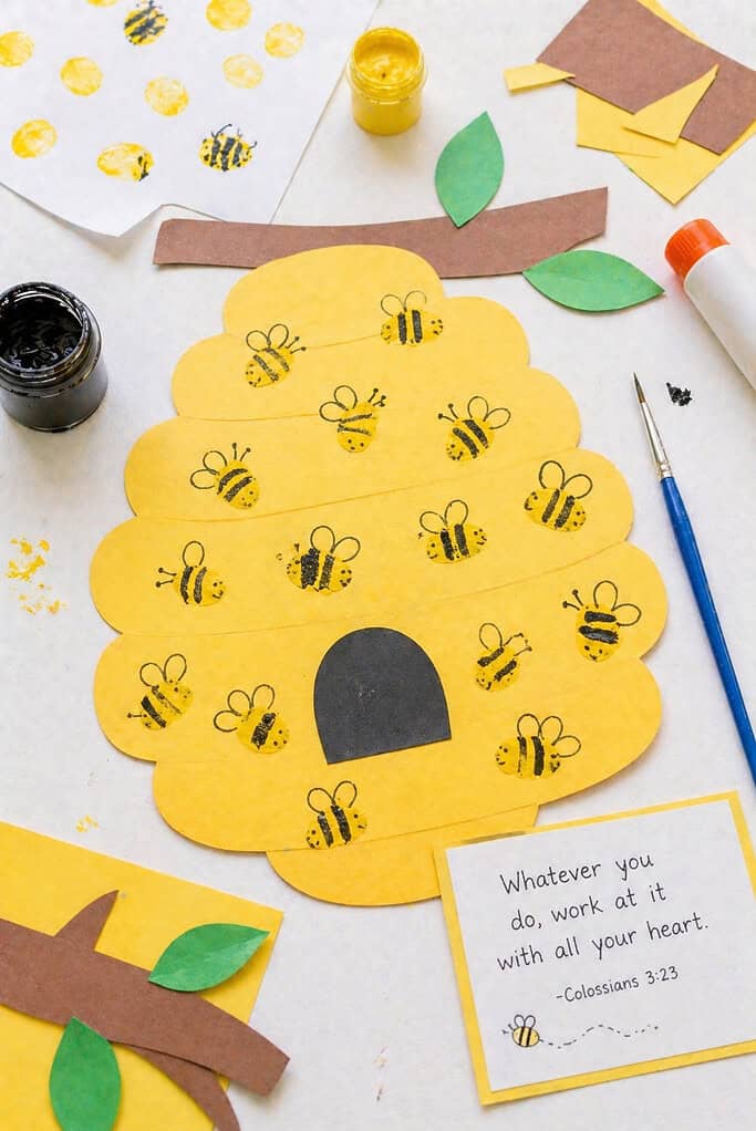 A simple hive shape cut from yellow or warm brown paper, with slightly uneven, hand-cut edges.