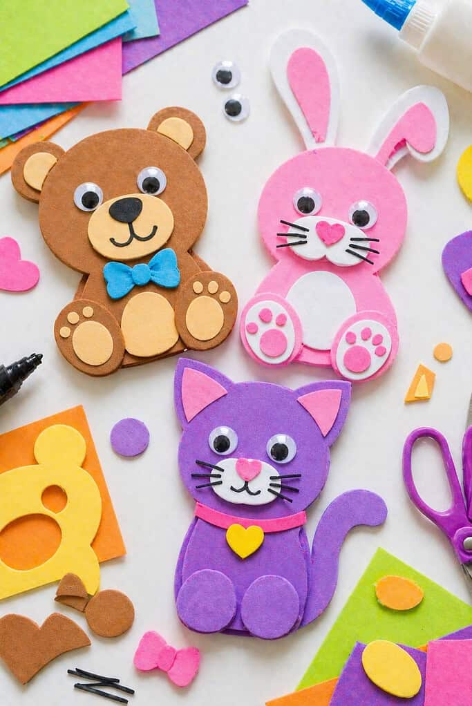 a small group of finished foam paper animals—such as a bear, a bunny, and a cat—each made from brightly colored foam sheets