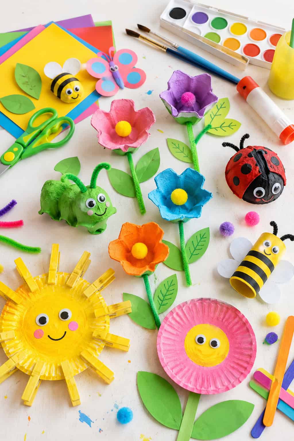 a variety of vibrant garden-themed craft materials neatly across the table