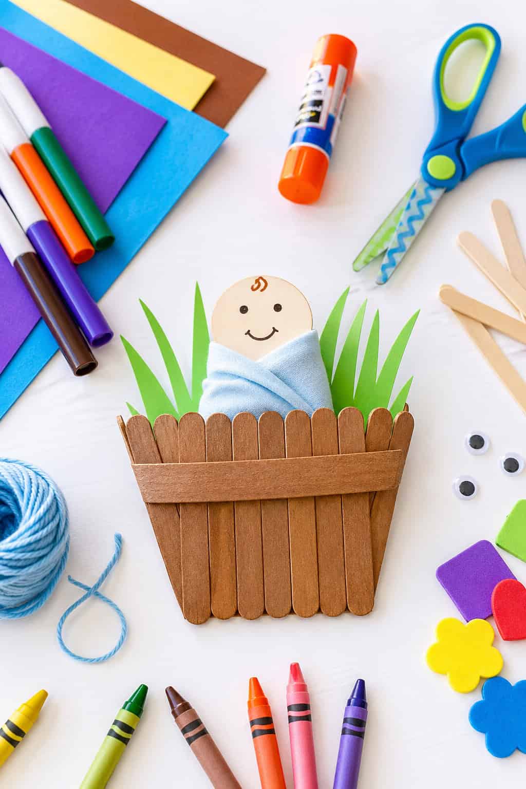 a simple, adorable Moses baby-in-a-basket craft made from kid-friendly materials.