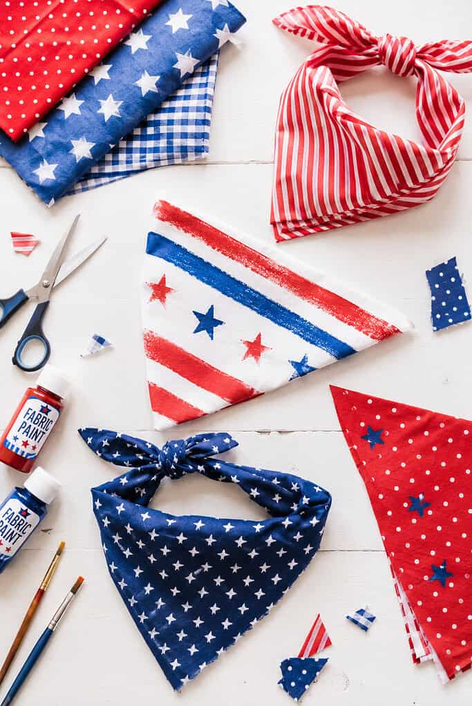handmade no-sew pet bandanas created from red, white, and blue cotton fabric