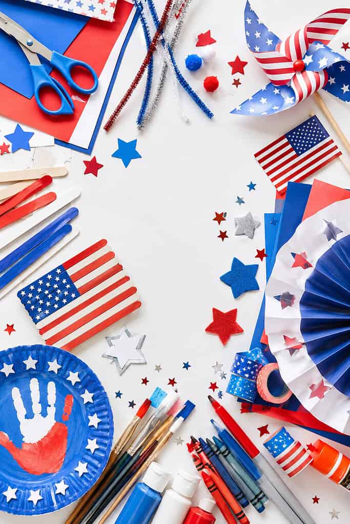 a vibrant mix of patriotic-themed kids craft supplies in red, white, and blue colors