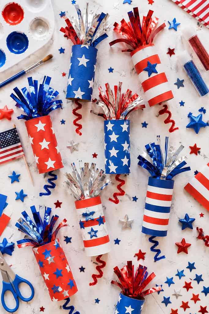 colorful handmade firecracker decorations created from recycled toilet paper rolls