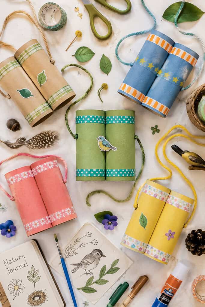 Two toilet paper rolls taped side by side with visible handmade assembly details