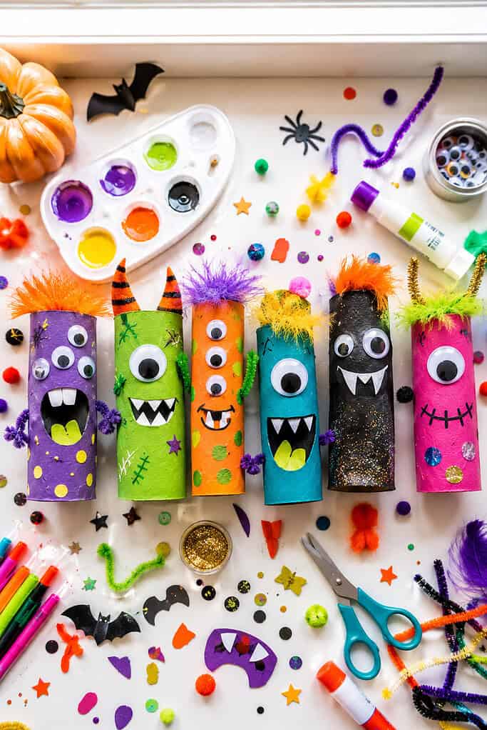 a colorful collection of wildly creative handmade monsters made from recycled toilet paper rolls