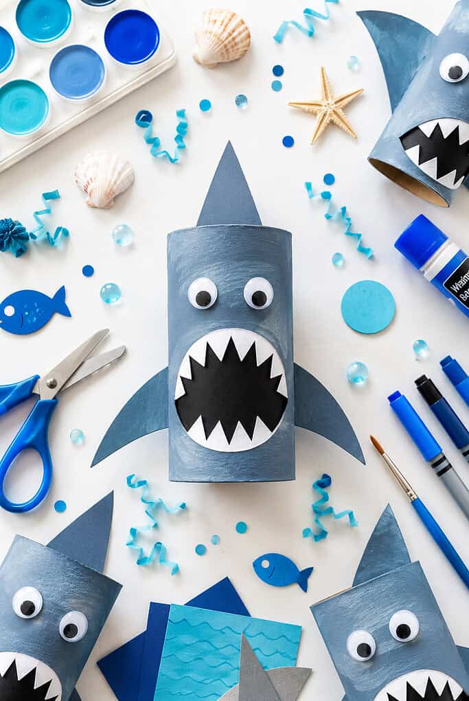 an adorable handmade shark created from a recycled toilet paper roll