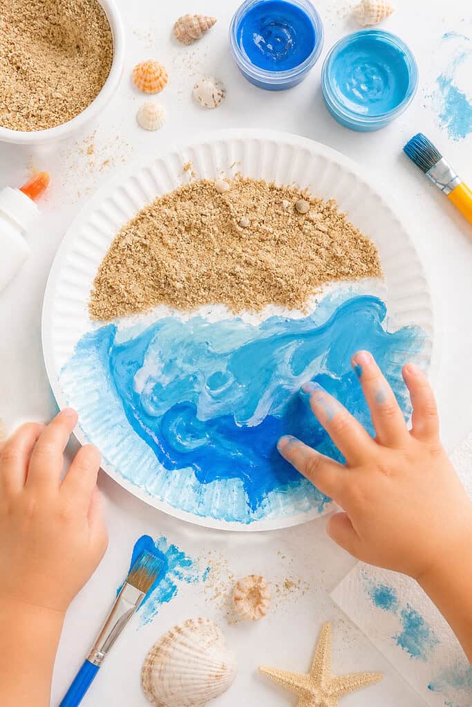 a simple beach paper plate craft designed for toddlers