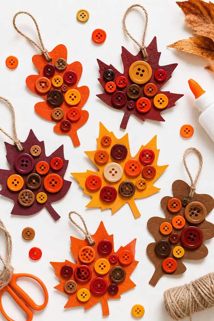 handmade autumn leaf crafts cut from cardstock in warm seasonal tones