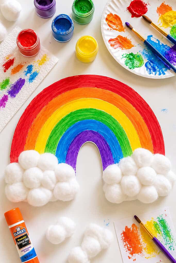 a handmade rainbow painted onto cardboard using bright washable paint.