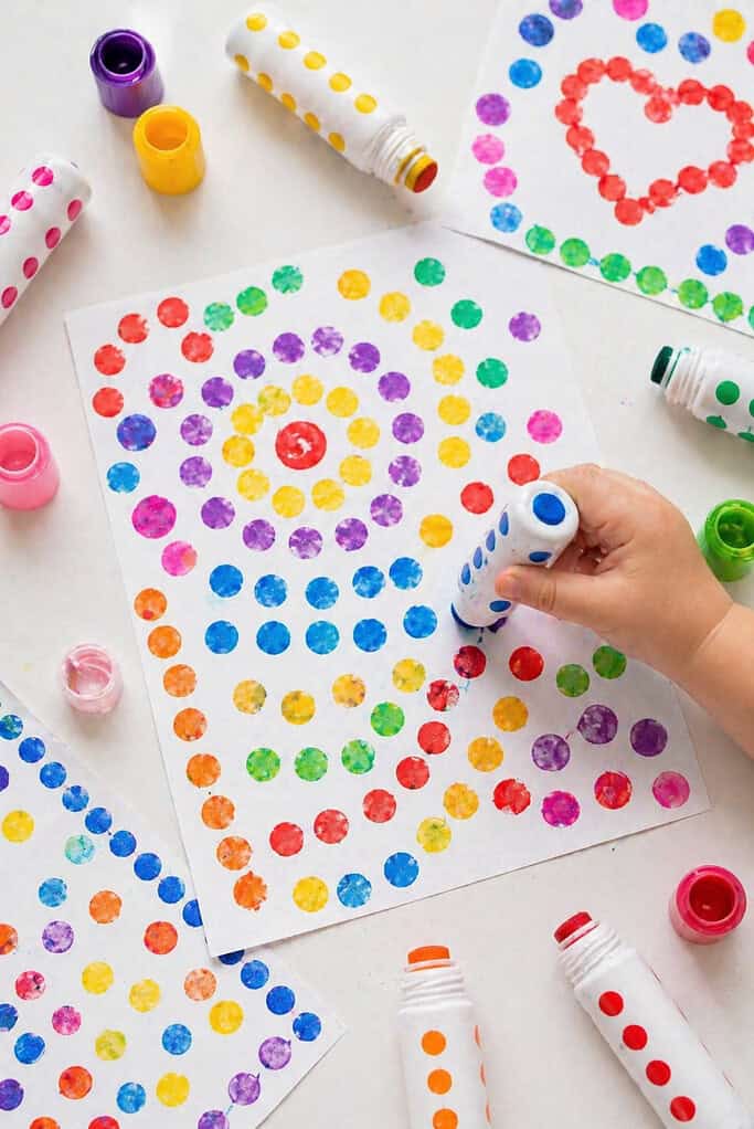 a sheet of white paper filled with colorful dot patterns