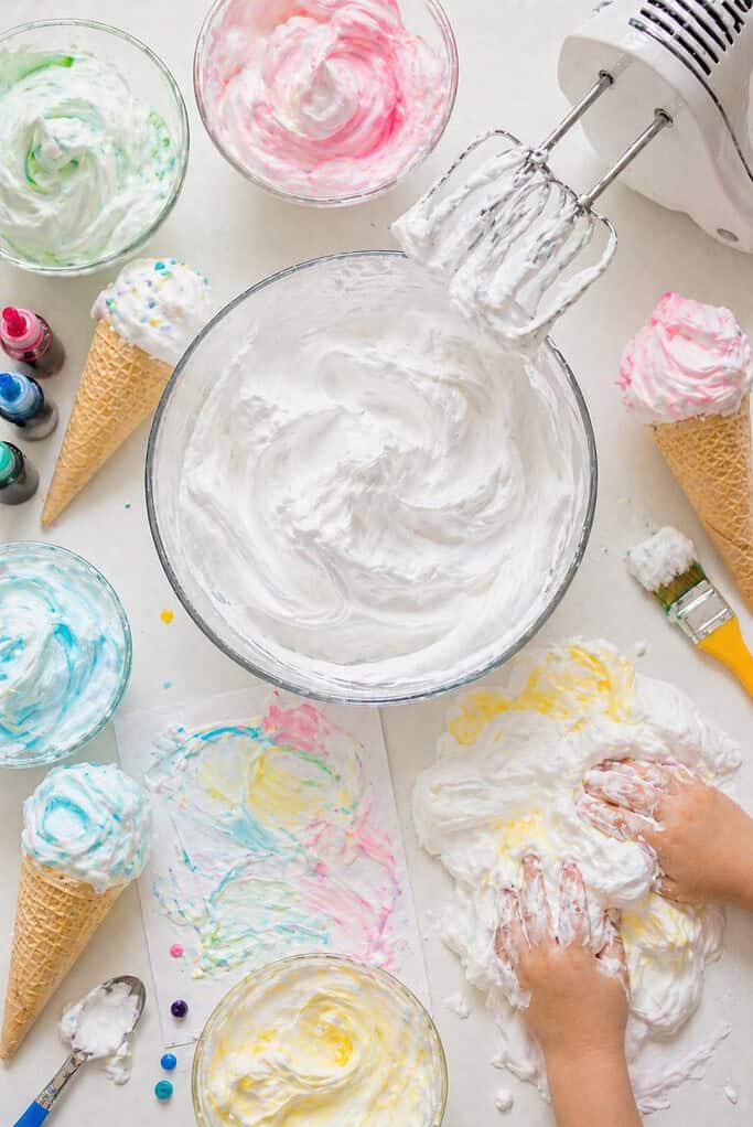 a large bowl filled with thick, fluffy foam resembling whipped cream or shaving foam.