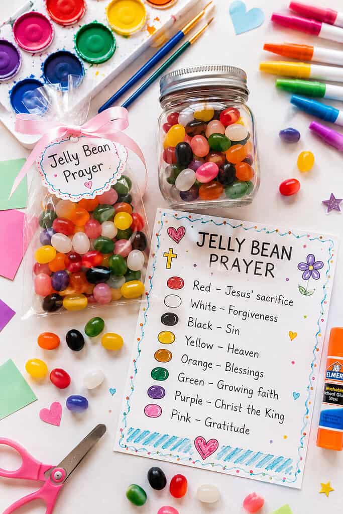 a small clear mason jar and a transparent treat bag filled with vibrant jelly beans in multiple bright colors: red, white, black, yellow, orange, green, purple, and pink